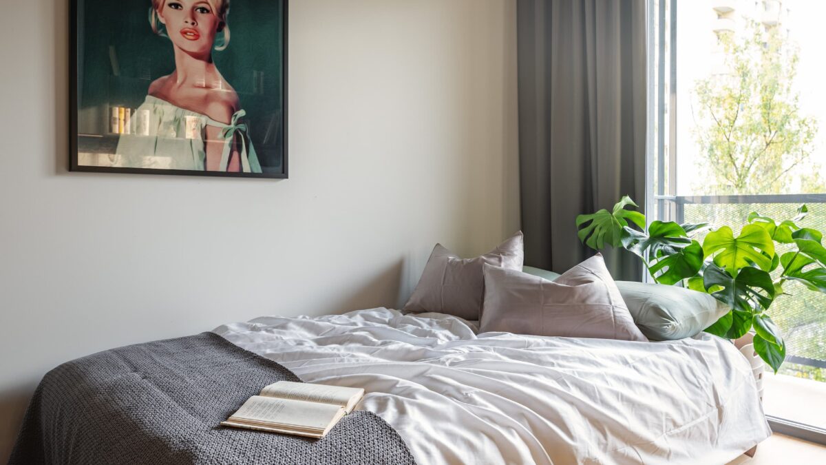 A made bed with a book on it